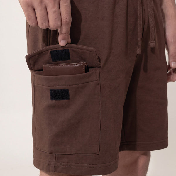 Wallet secured in the velcro cargo pocket of brown cargo shorts
