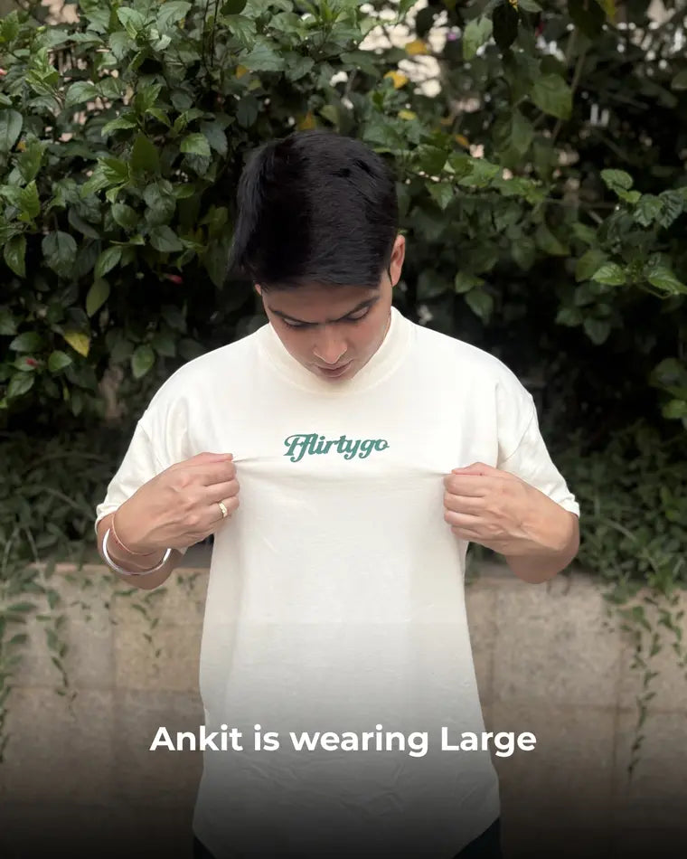 A FflirtyGo customer wearing the basics tee in L